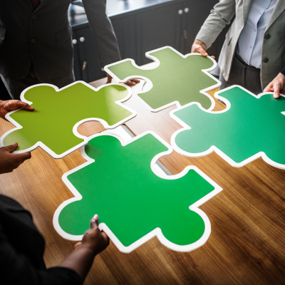 business-people-connecting-puzzle-pieces 1 business-people-connecting-puzzle-pieces 1